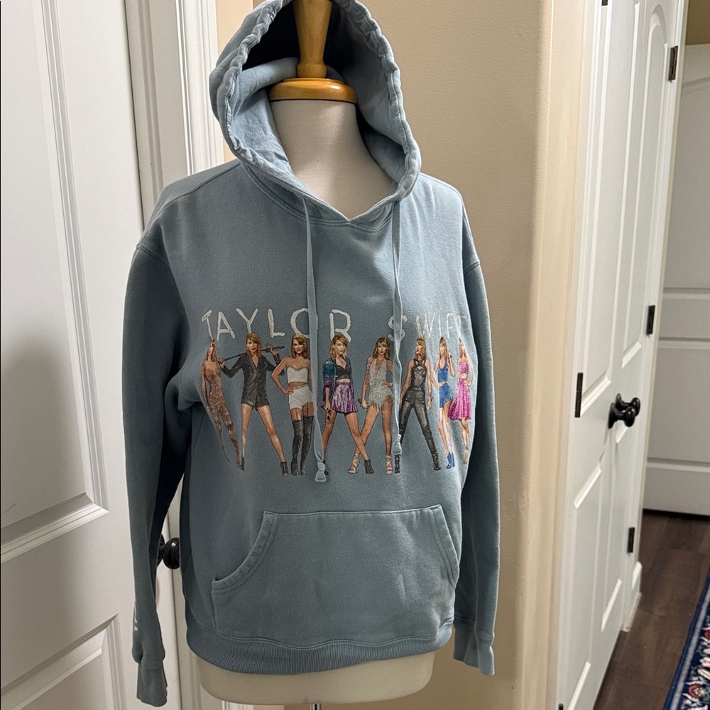 Taylor Swift Light Blue Graphic Hoodie with Multi-Figure Print